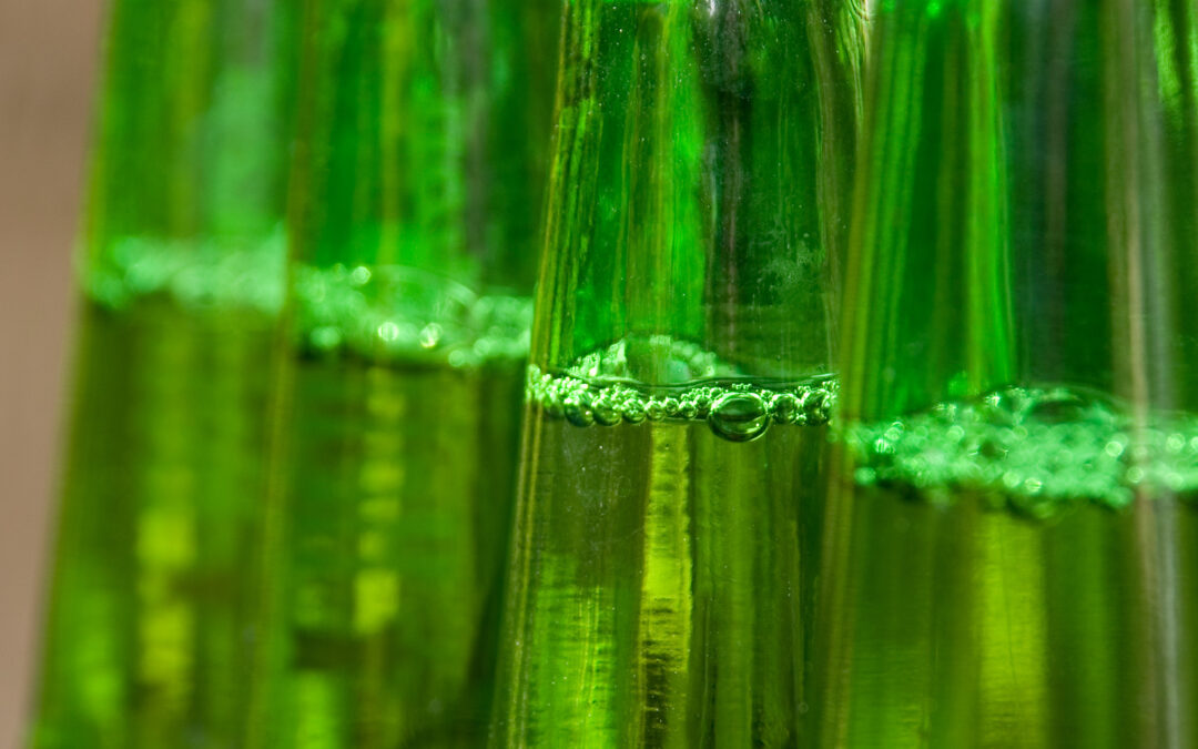 Row of Green Beer Bottles Unopened