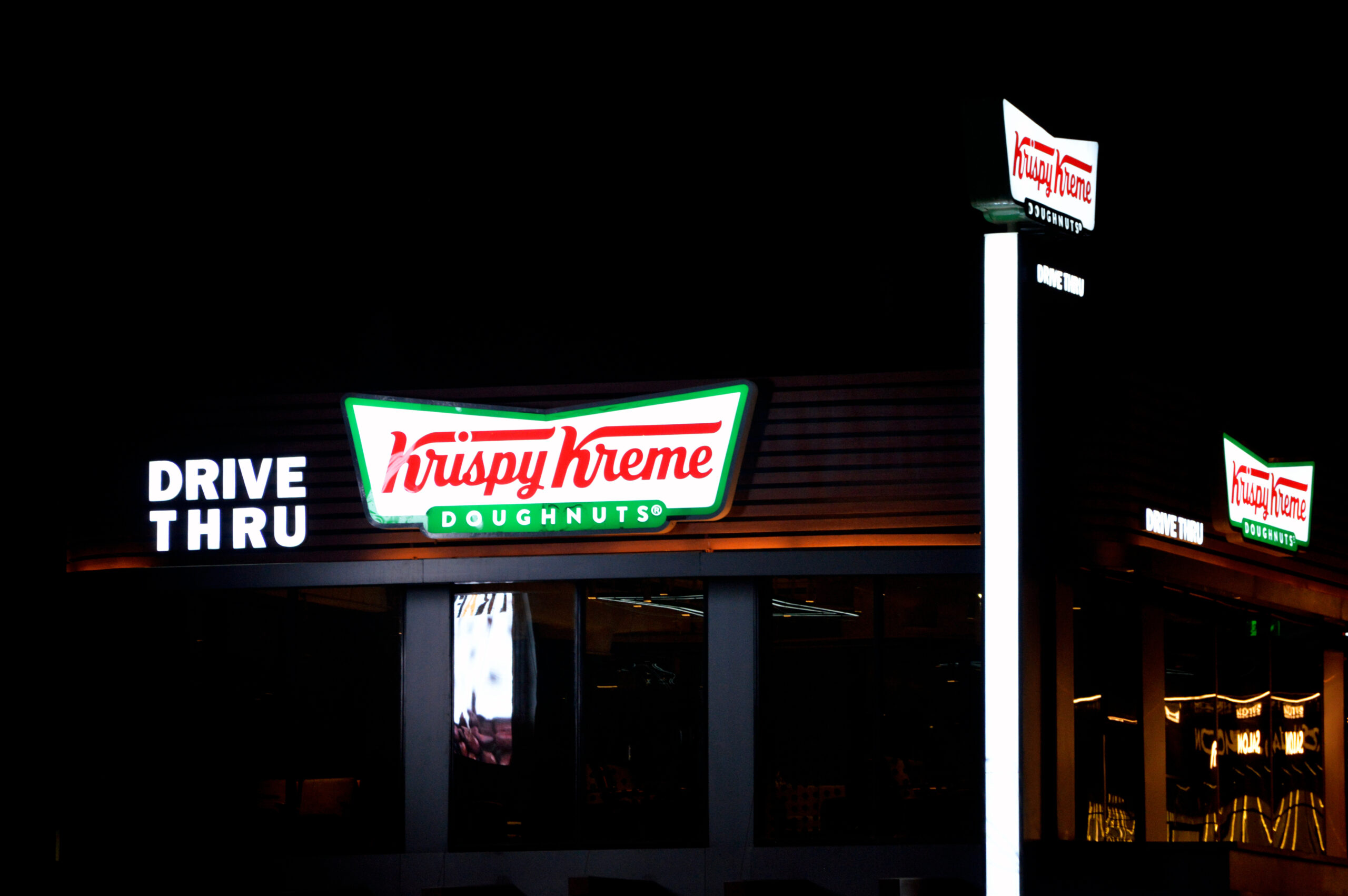 Cairo, Egypt, August 9 2023: Krispy Kreme, Inc., previously Krispy Kreme Doughnuts, Inc., an American multinational doughnut company and coffeehouse chain, founded by Vernon Rudolph (1915–1973)