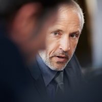 a close up image of a mature business man