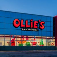 Rome, NY - Dec 6, 2025: Ollie’s Bargain Outlet storefront in winter, featuring bold signage, festive holiday inflatables, and during an active seasonal promotion