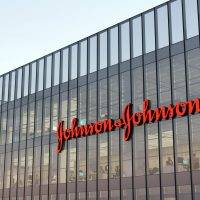 New Brunswick, NJ, USA. May 2, 2022. Editorial Use Only, 3D CGI. Johnson & Johnson Signage Logo on Top of Glass Building. Workplace of Pharmaceutical Industry Company Office Headquarters.